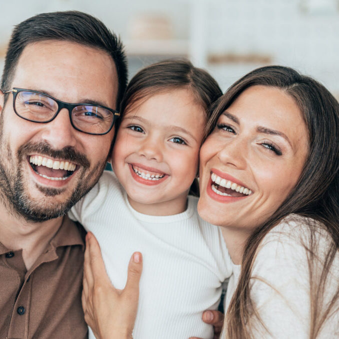 Family portrait Family portrait - mother, father and daughter happy at home